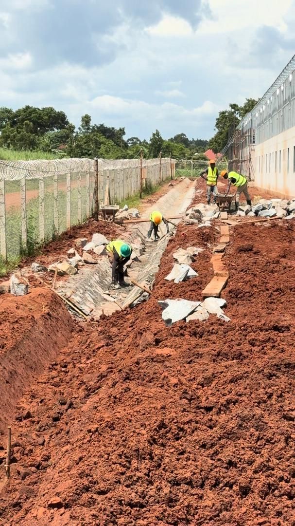 Stone pitching: lining the drainage channel behind the dormitories